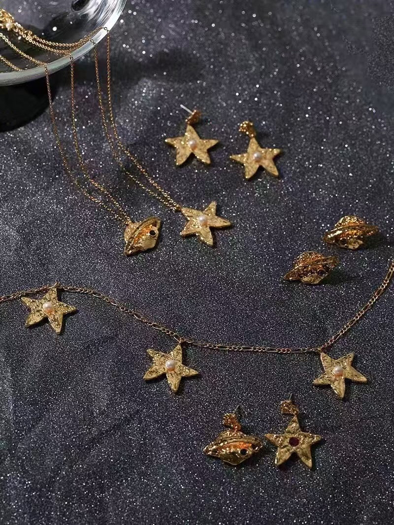 star gold necklace and earrings